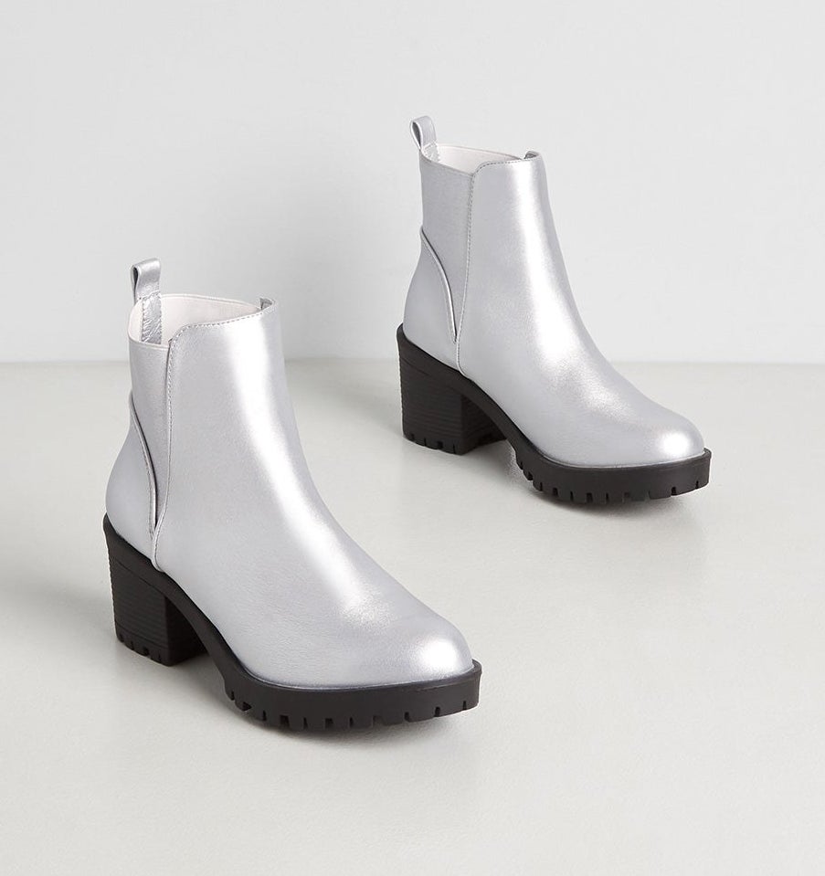 the silver booties with black soles