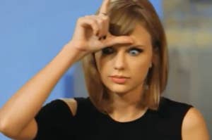 taylor swift doing an "L" on her forehead