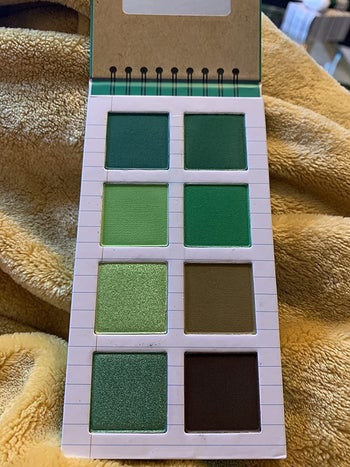 notepad with eyeshadow palette inside