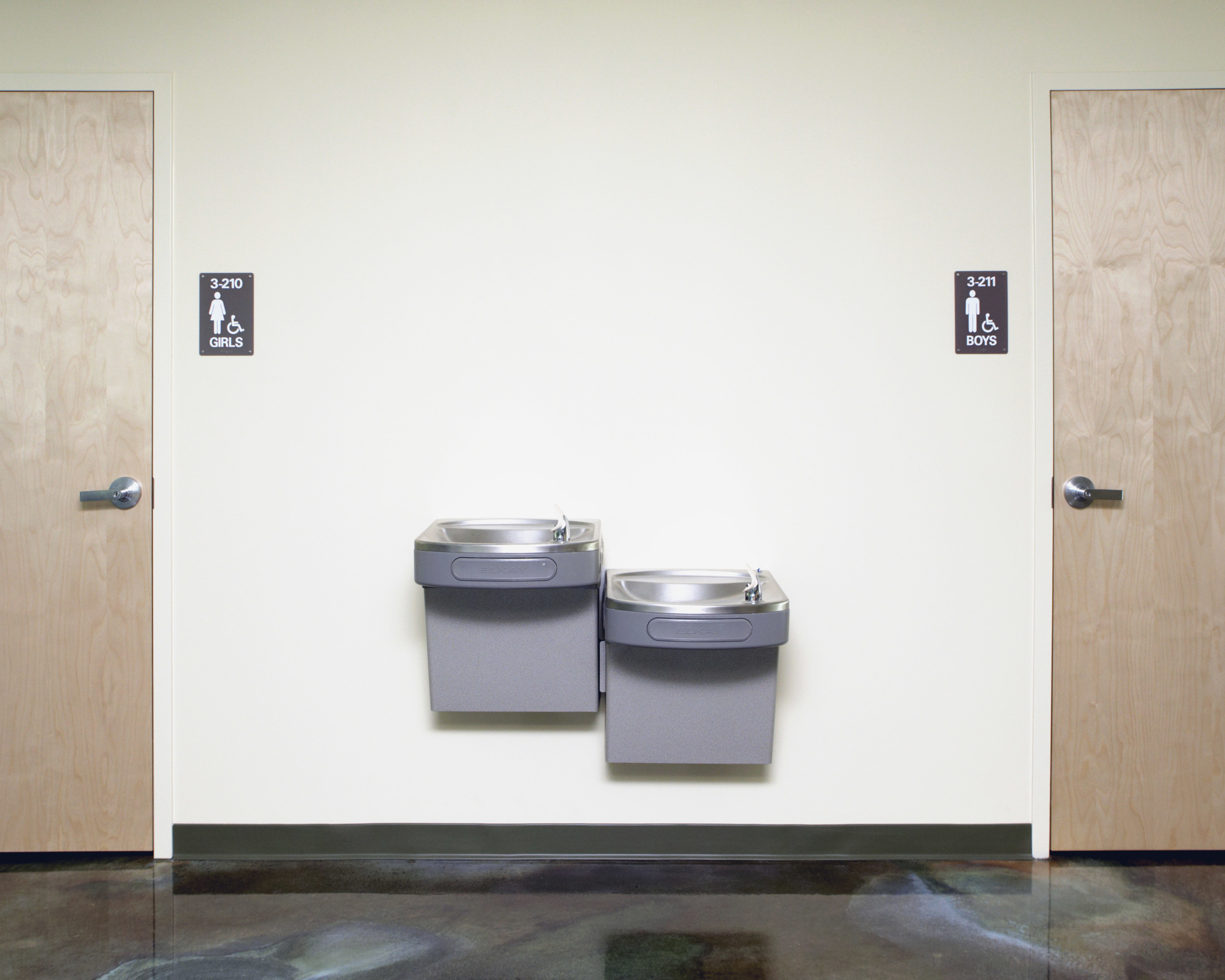 boys and girls room next to water fountains in a school