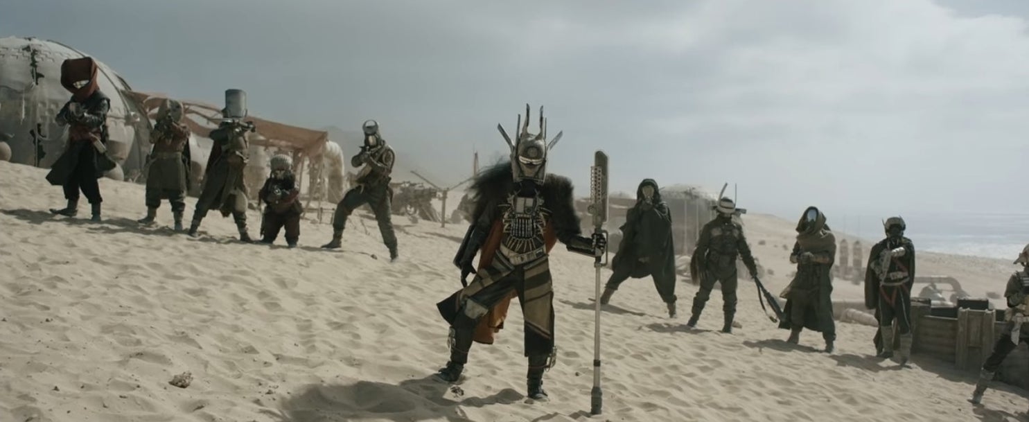 Erin Kellyman as Enfys Nest standing in front of a team of intergalactic pirates in &quot;Solo: A Star Wars Story&quot;