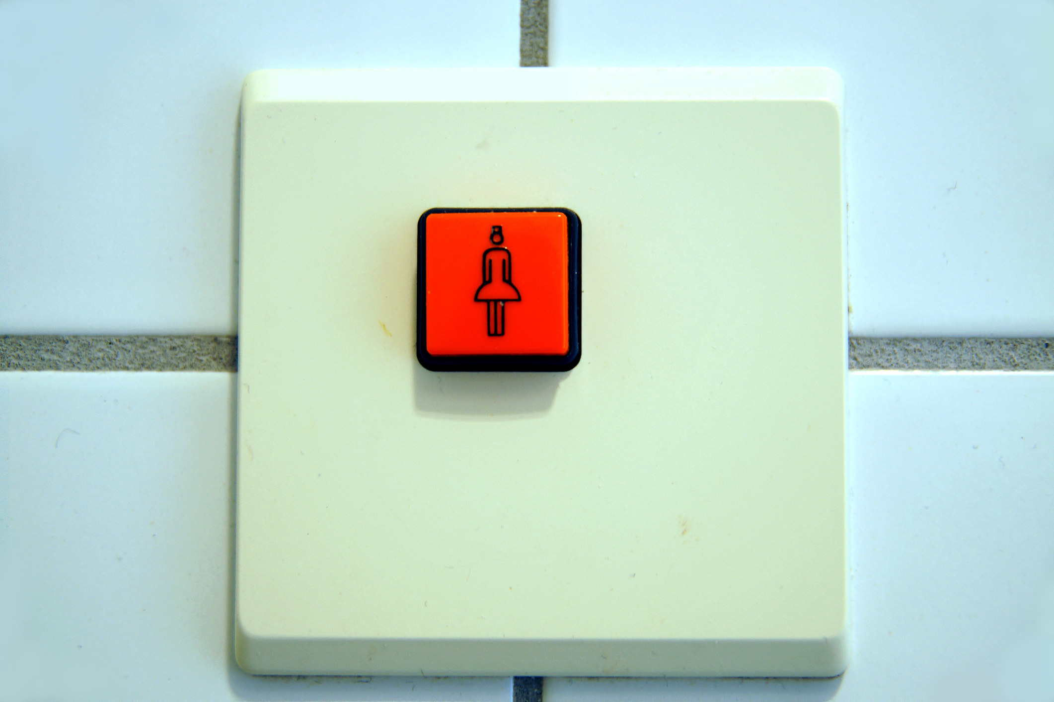 Nurse call button in the bathroom in a nursing home in old condition