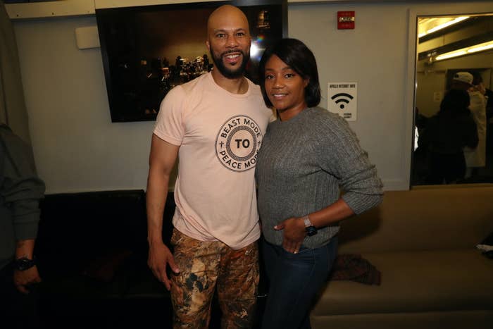 Haddish stands next to Common