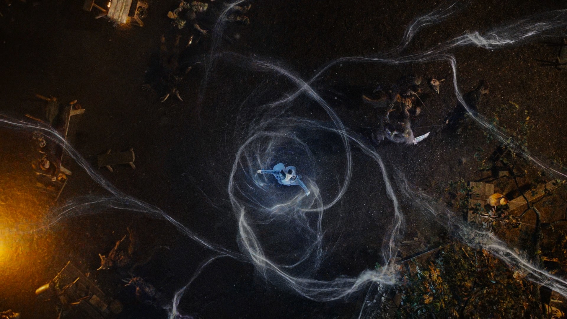 An overhead shot of Moiraine using the One Power in dozens of weaves as she defends the Two Rivers. Lan (Daniel Henney), using his sword, fights off approaching trollocs that attempt to stop her