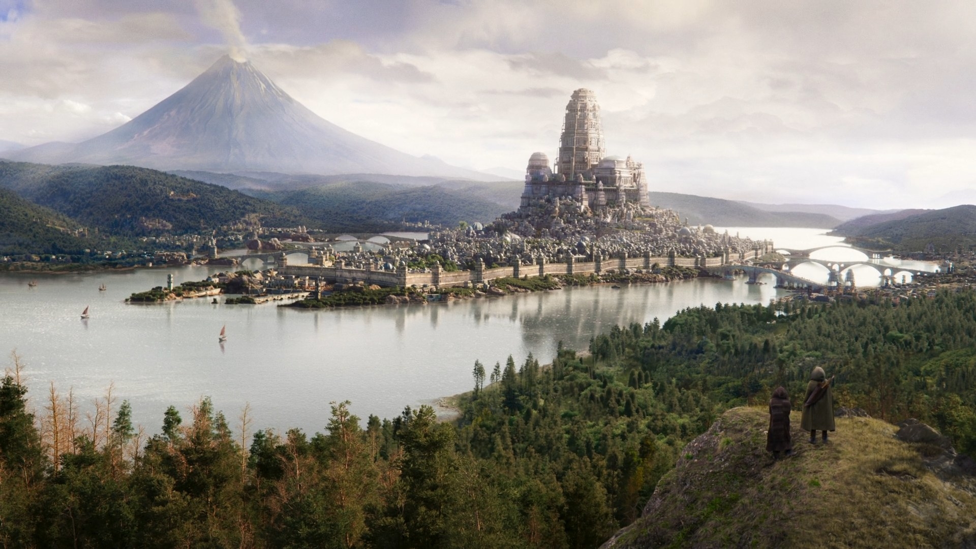 A wide, establishing shot shows Tar Valon on an island in the middle of a river. It is dominated by a massive structure rising out of the middle of the island, the White Tower. In the distance, we can see a huge, smoking volcano