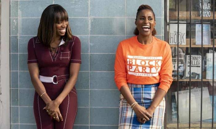 insecure&#x27;s molly and issa standing by a wall and laughing