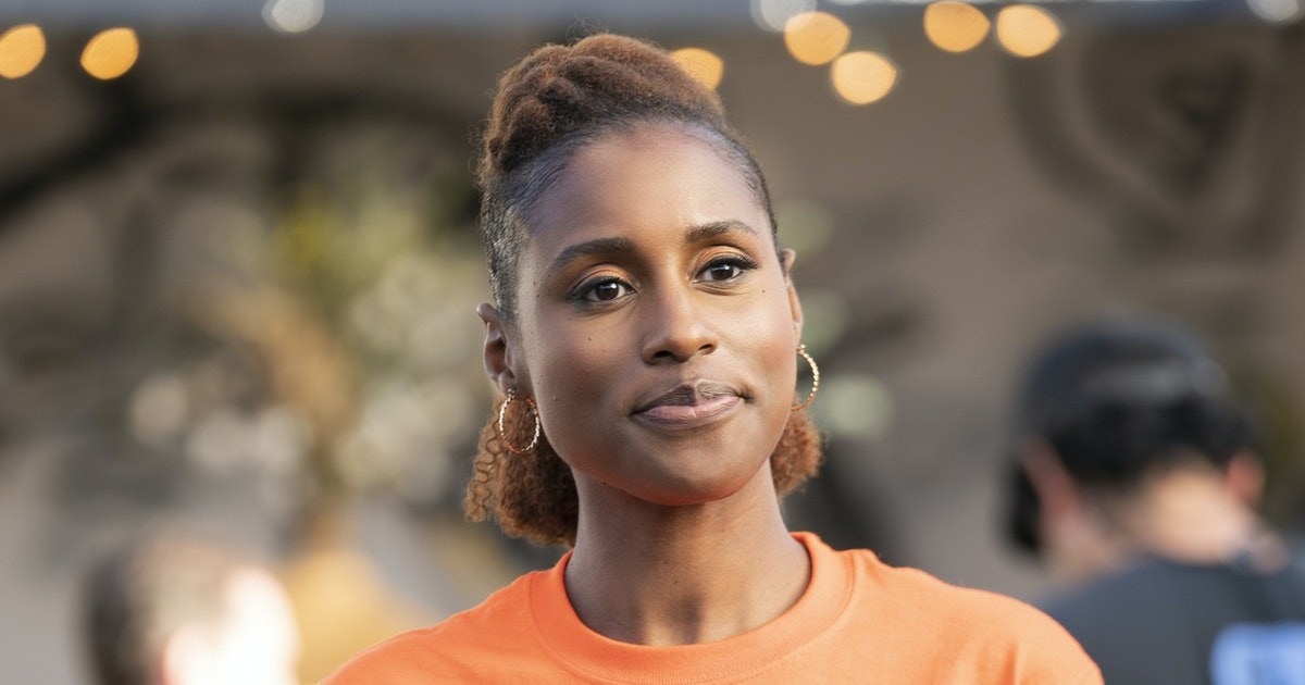insecure&#x27;s issa wearing a half up, half down natural hairstyle