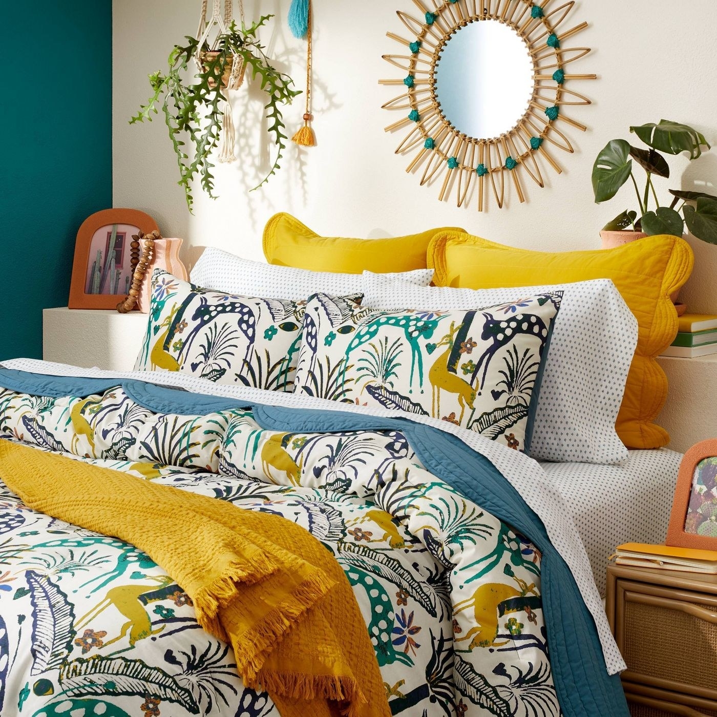 A brightly colored bed with a printed comforter