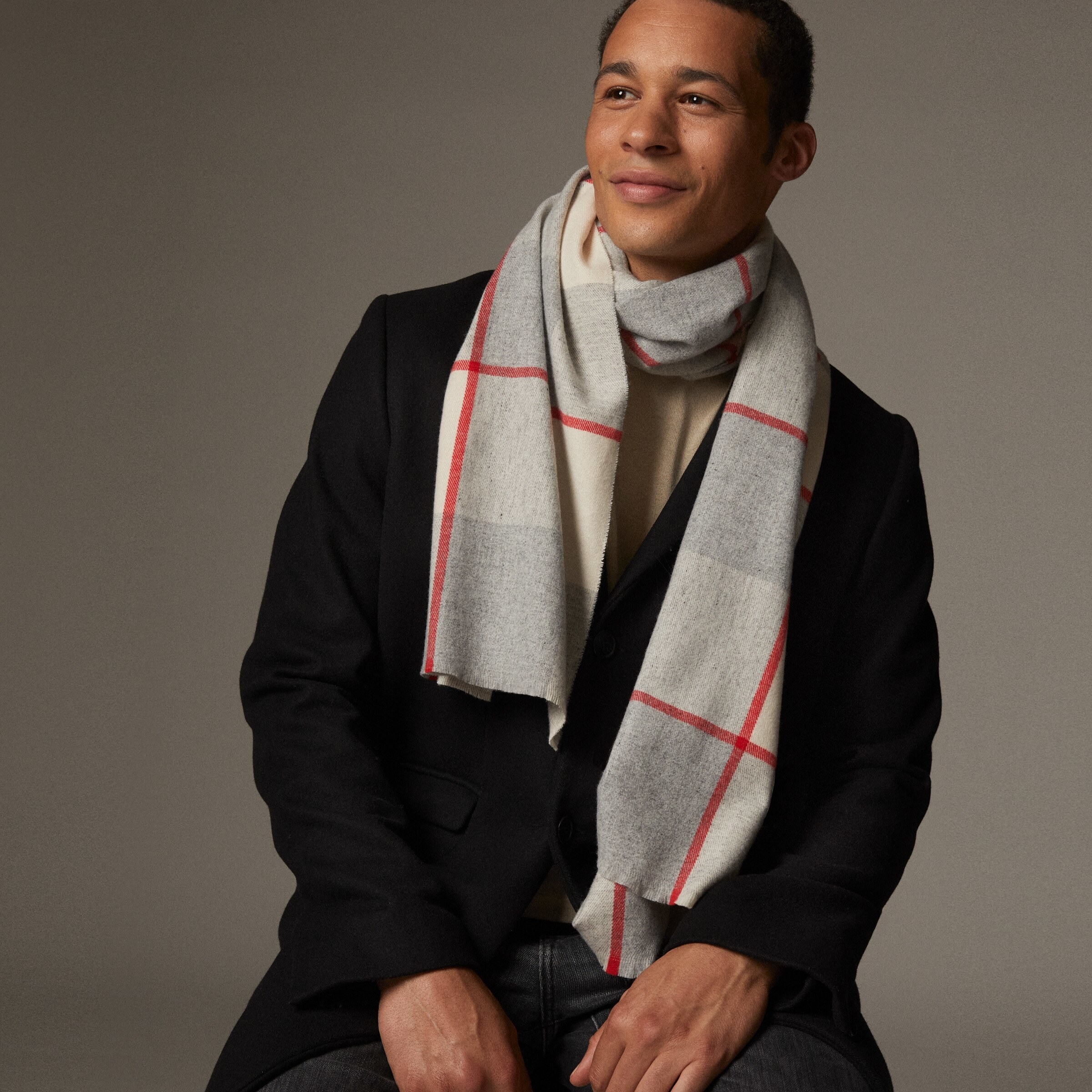 a smiling person wearing the scarf