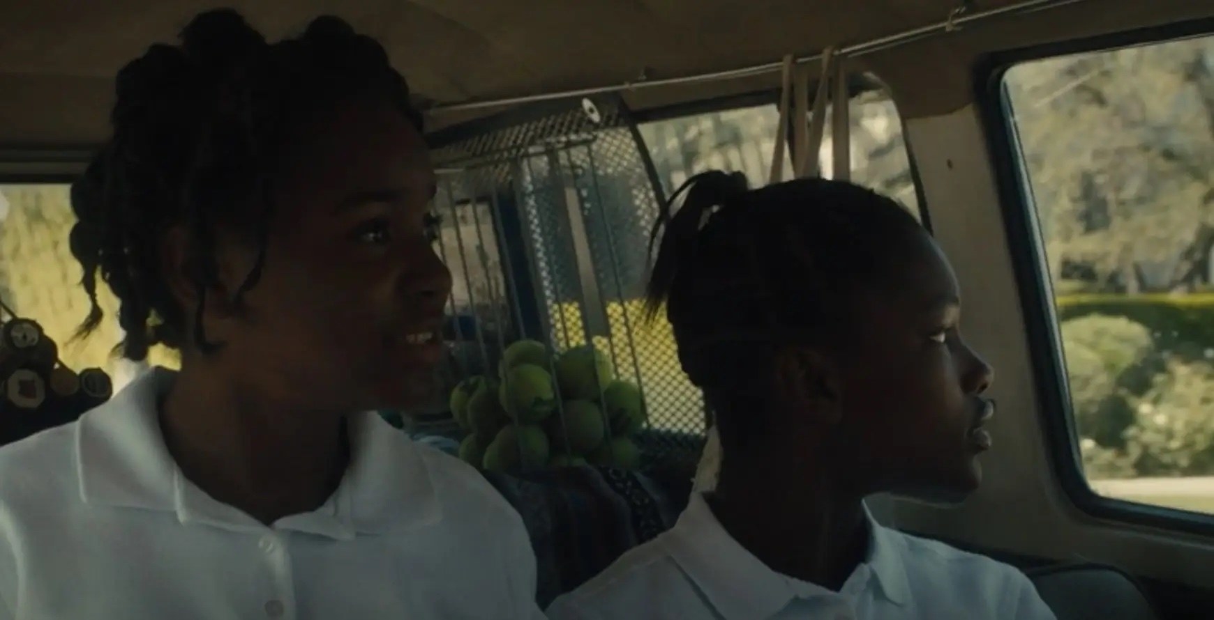 serena and venus in king richard, looking out a car window