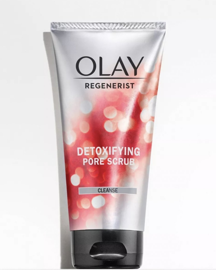 Product shot of Olay&#x27;s detoxifying pore scrub in red and silver bottle