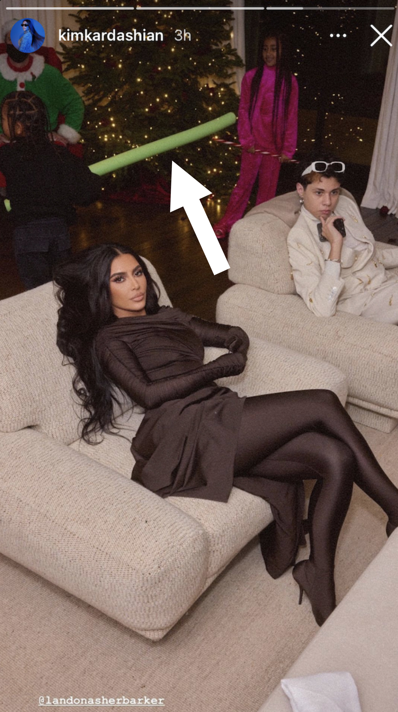 Kim and Landon Barker lounging on individual couches next to each other
