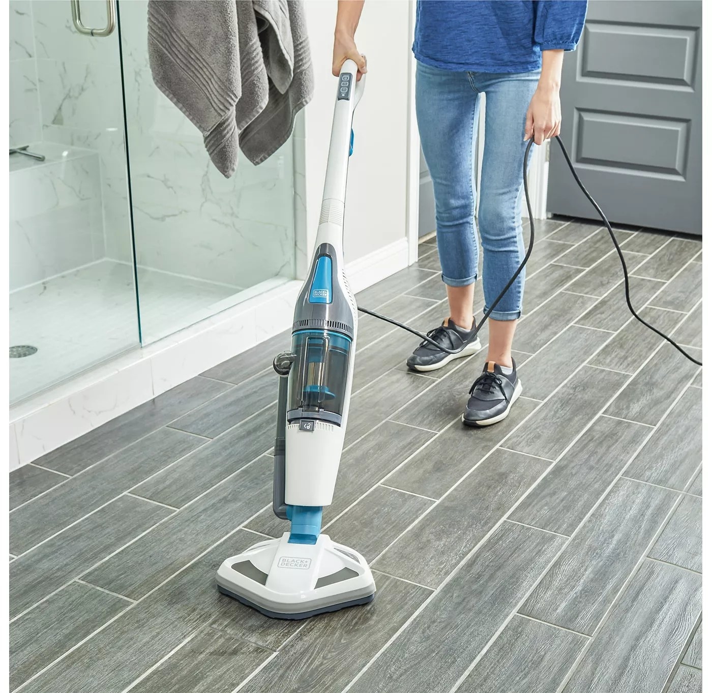 The white, blue, and gray Black and Decker steam mop and upright vacuum