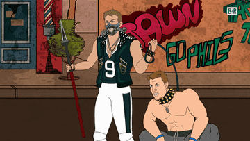 Rob Gronkowski raises a spear while holding a leashed, collared, and shirtless Nick Foles in &quot;Gridiron Heights&quot;