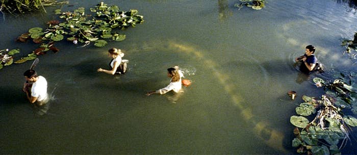 A group of explorers navigate through troubled waters in
