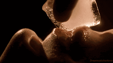 An ice cub is rubbed across a pair of lips in