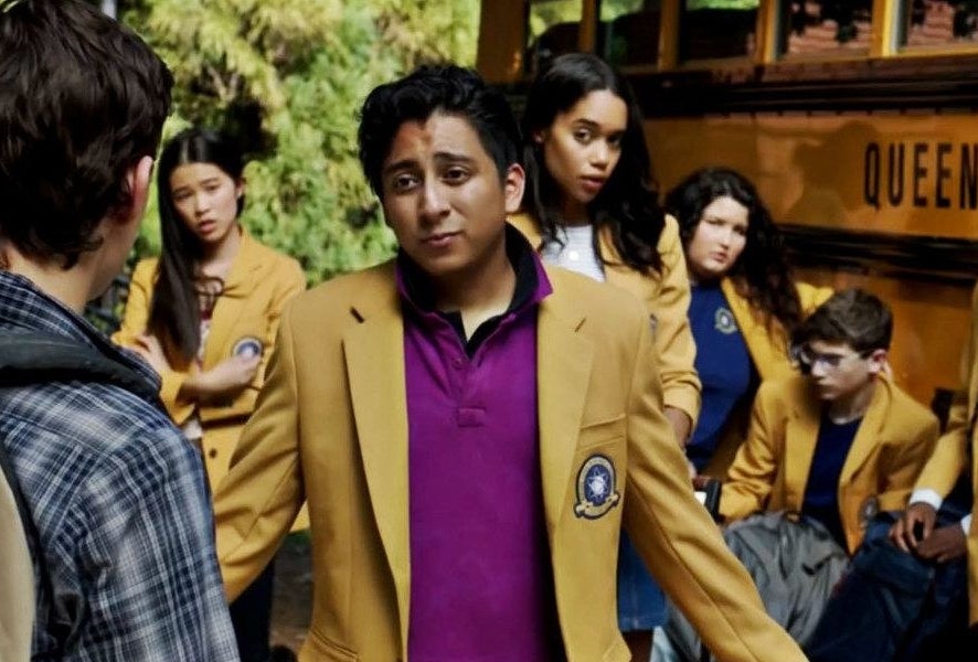 Tony Revolori in a yellow coat