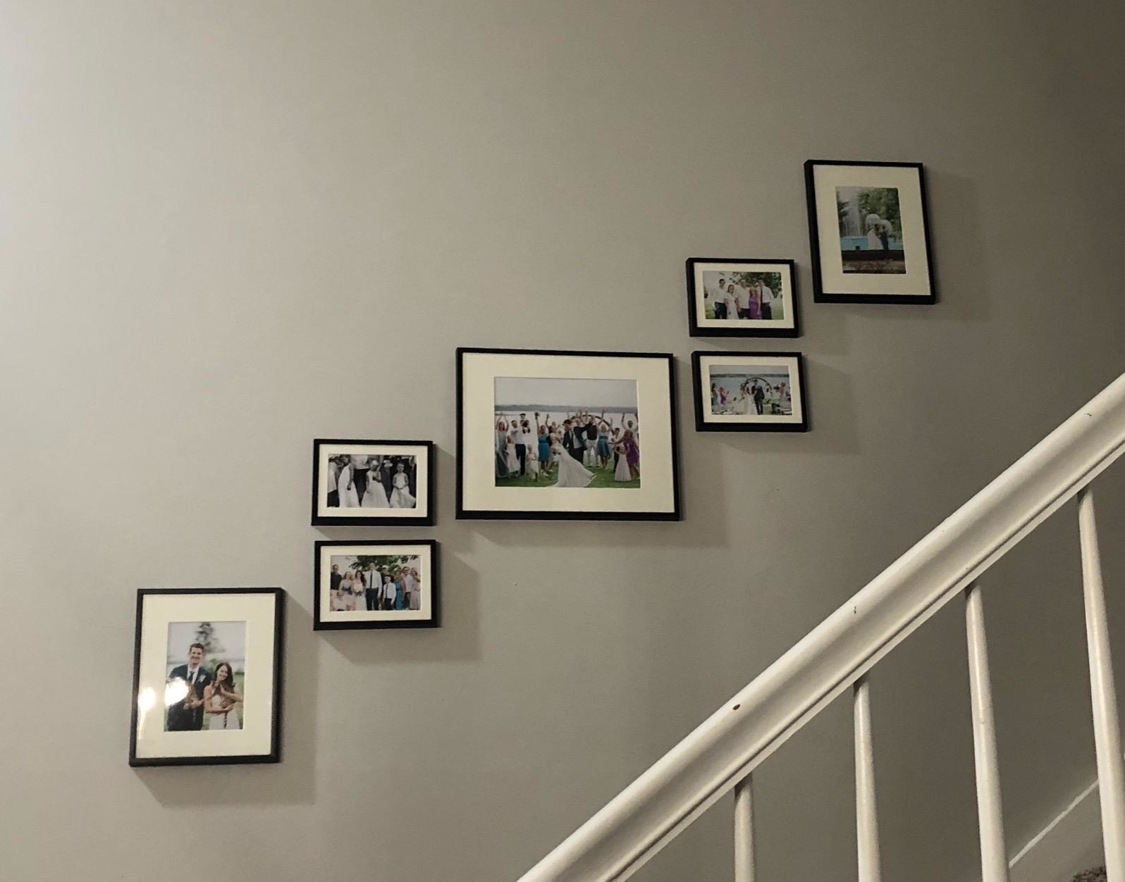 reviewer image of gallery wall on staircase wall