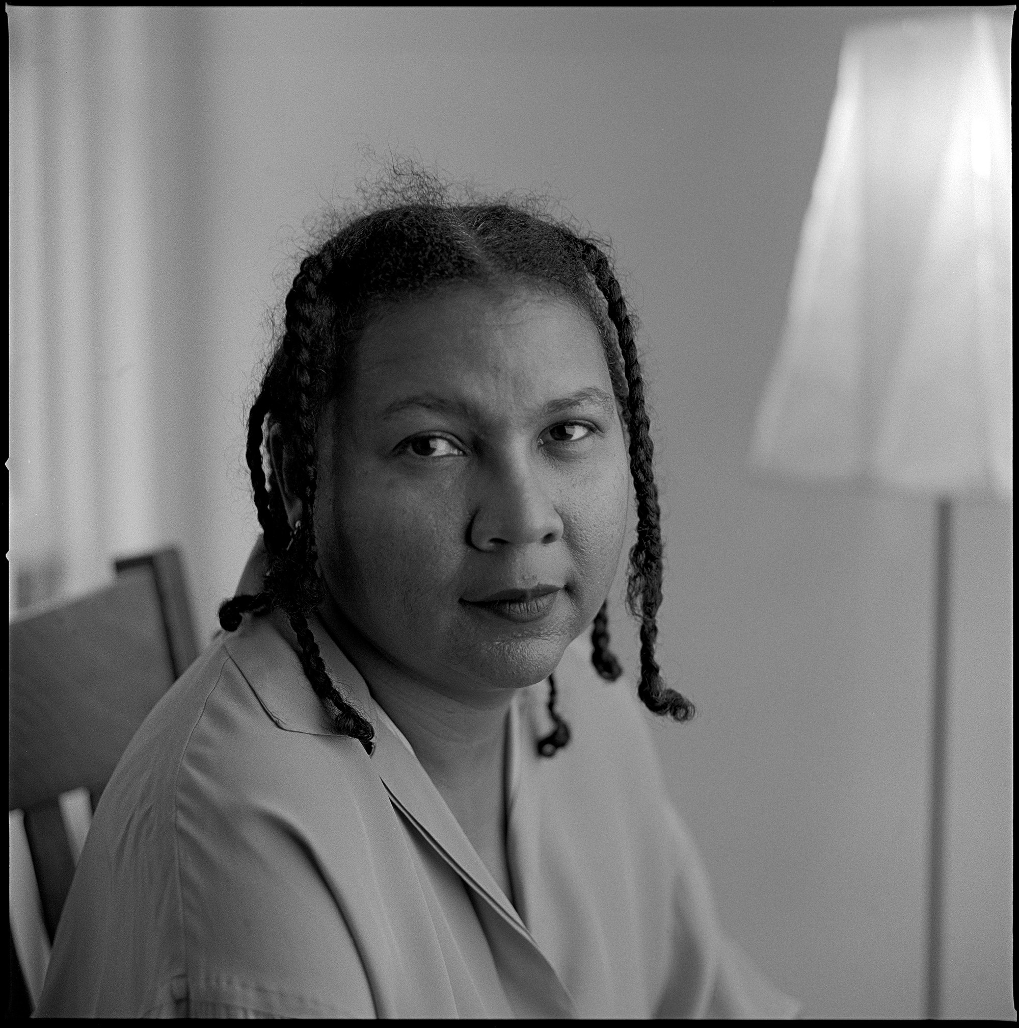 bell hooks seated and looking at the camera