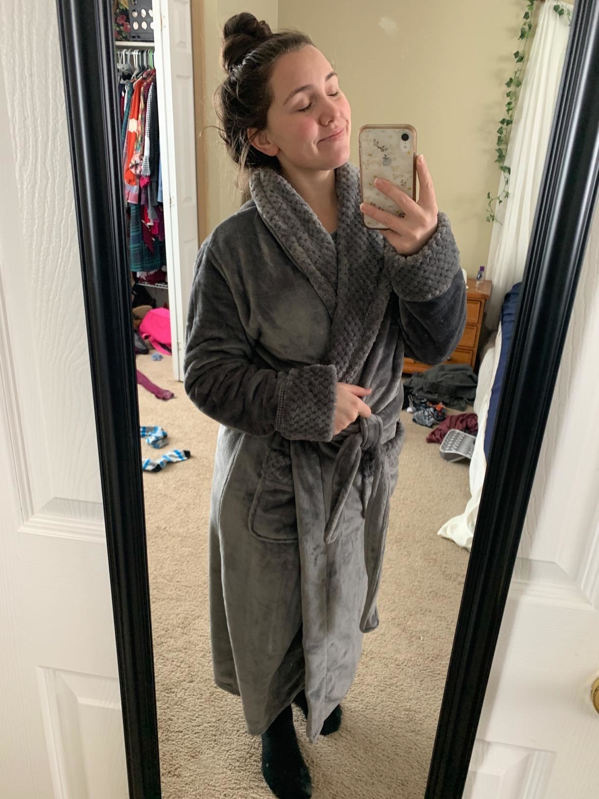 mirror selfie of reviewer wearing the gray robe