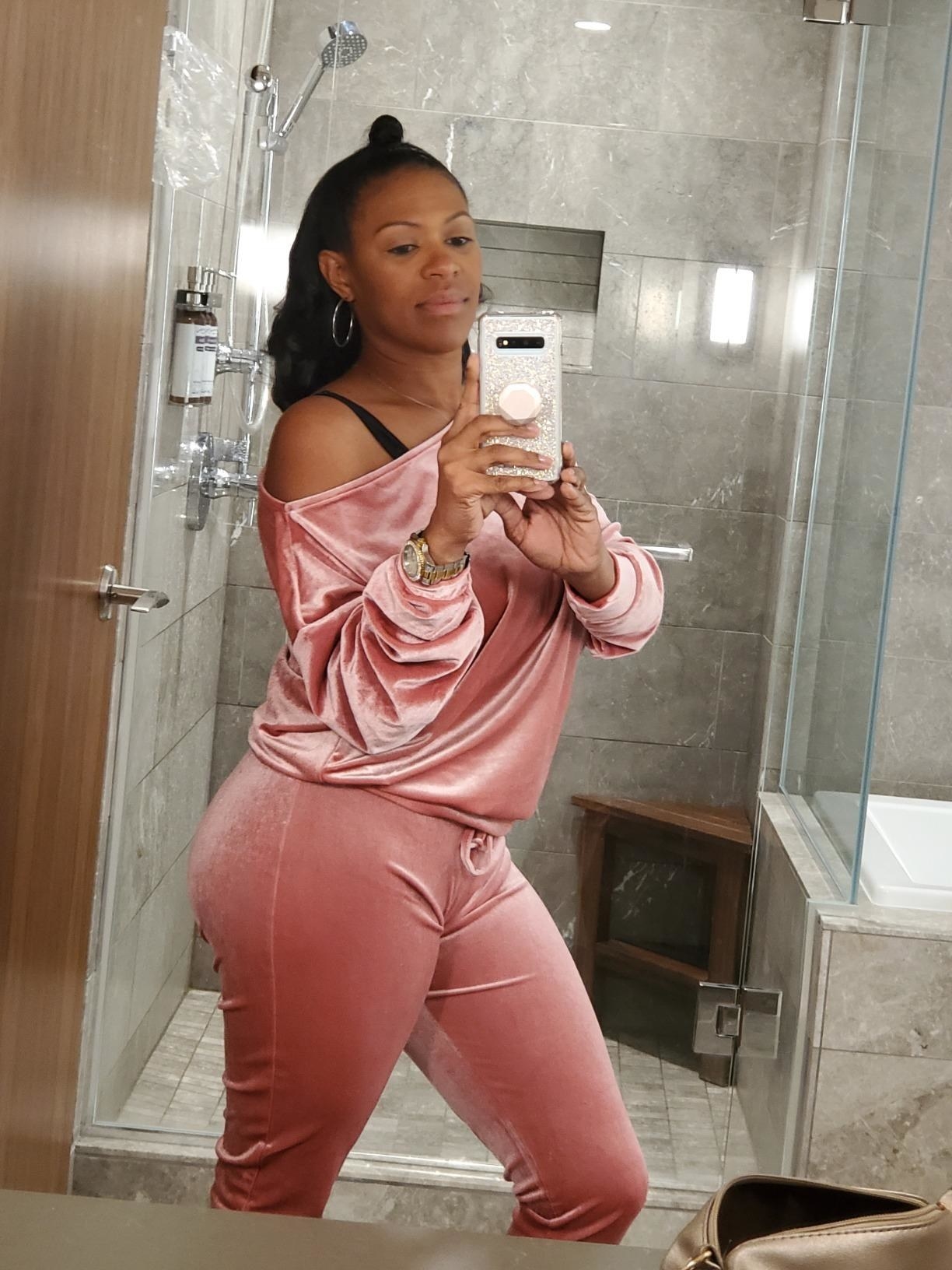 mirror selfie of reviewer wearing the pink velvet loungewear set