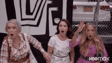 Miranda, Charlotte, and Carrie looking shocked in
