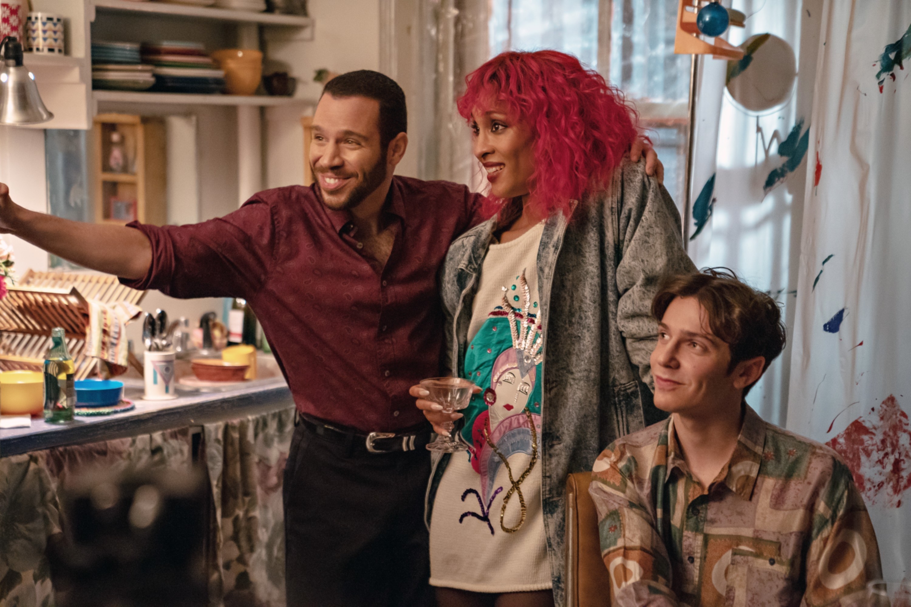 Robin de Jesus, MJ Rodriguez, and Ben Ross stand in a kitchen