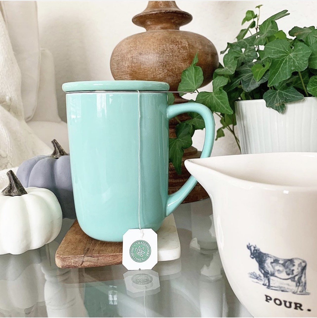 the tea mug with the infuser steeping in mint blue