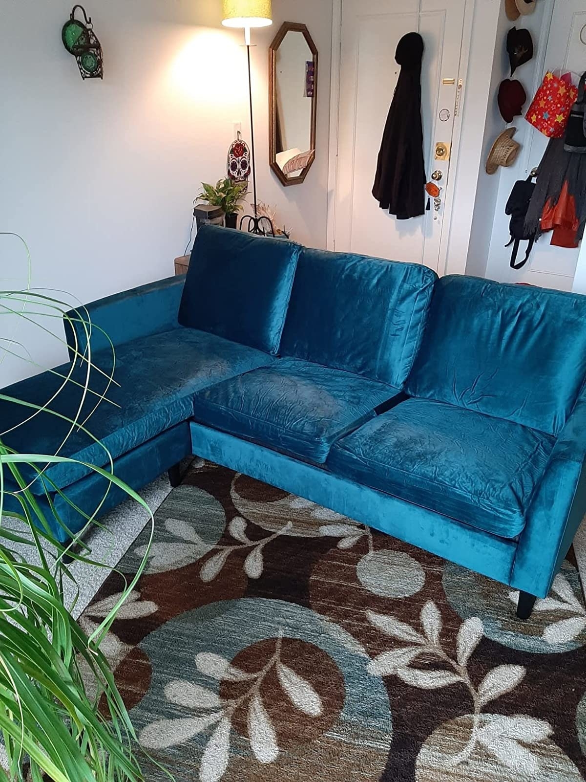 Amazon reviewer photo of the green/blue velvet sectional sofa