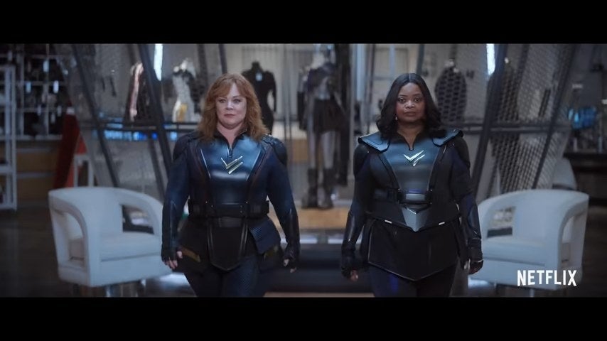 Lydia and Emily walking together in their super suits in "Thunder Force"