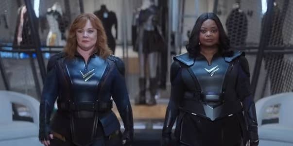 Lydia and Emily walking together in their super suits in &quot;Thunder Force&quot;
