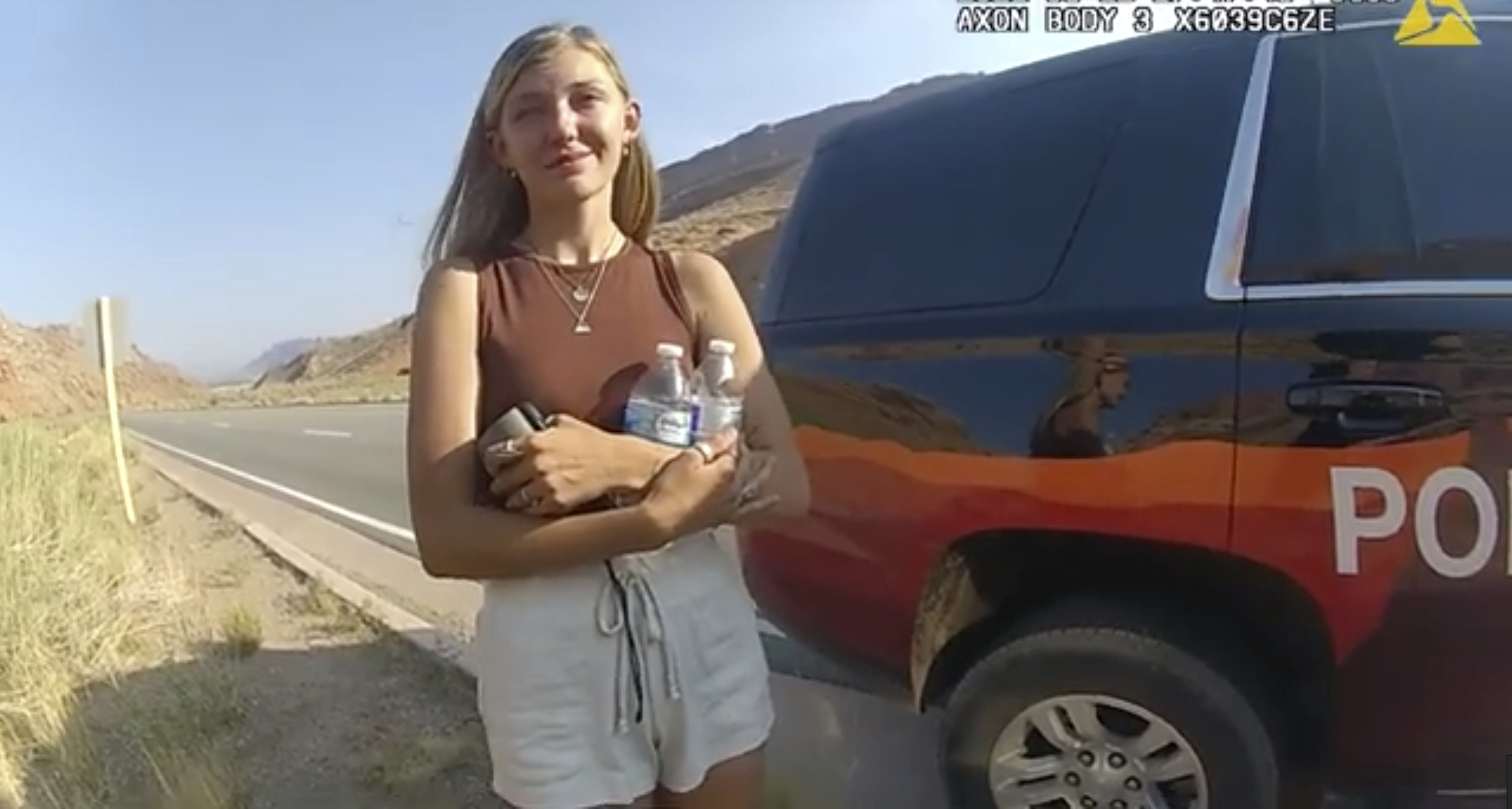 A photo from a body cam recording of Gabby Petito speaking with authorities