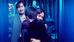 Harry and Sirius hugging while Remus stands nearby in Order of the Phoenix
