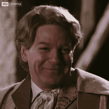 Lockhart smiling proud of coquettishly