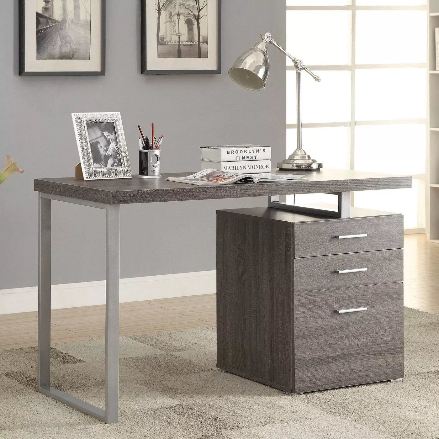 The weathered gray desk with a file cabinet