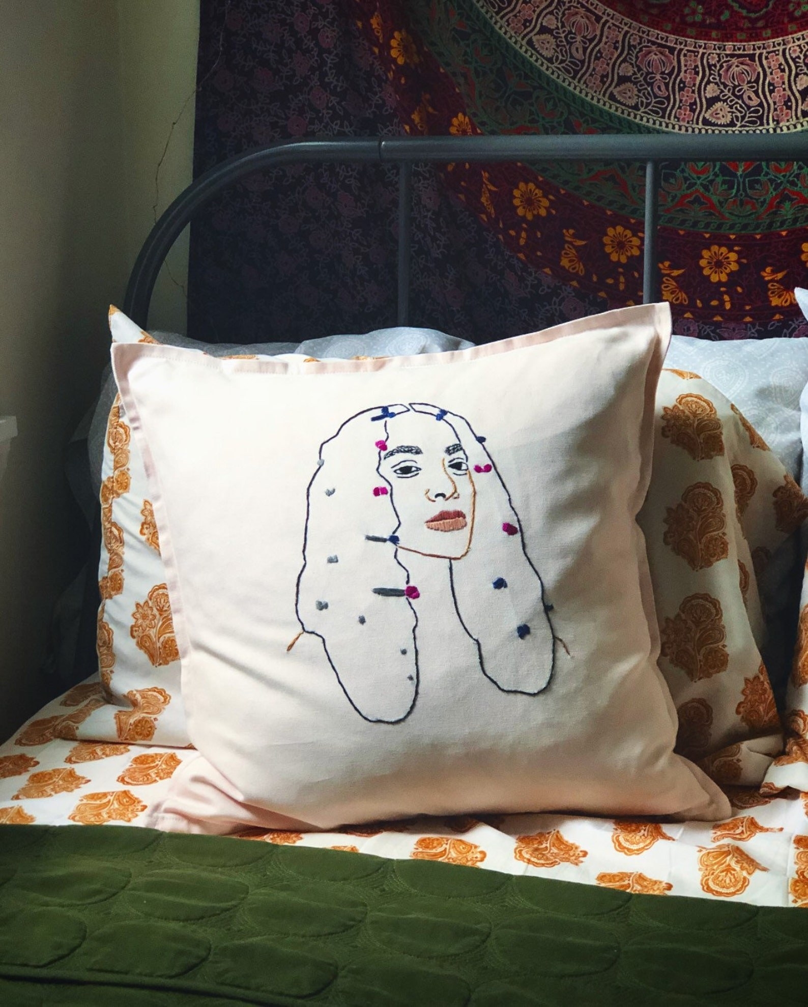 the solange 20x20 pillow on a bed
