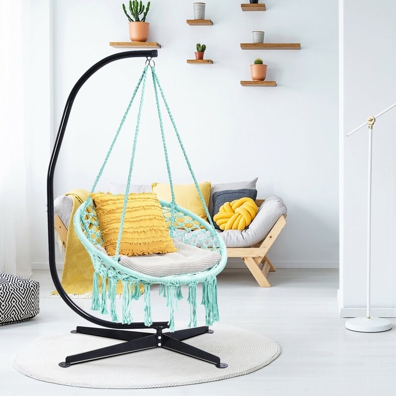 the turquoise hammock chair in a living room