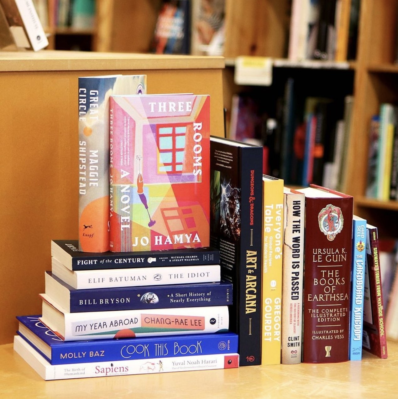 A stack of books on display at the in-person bookstore