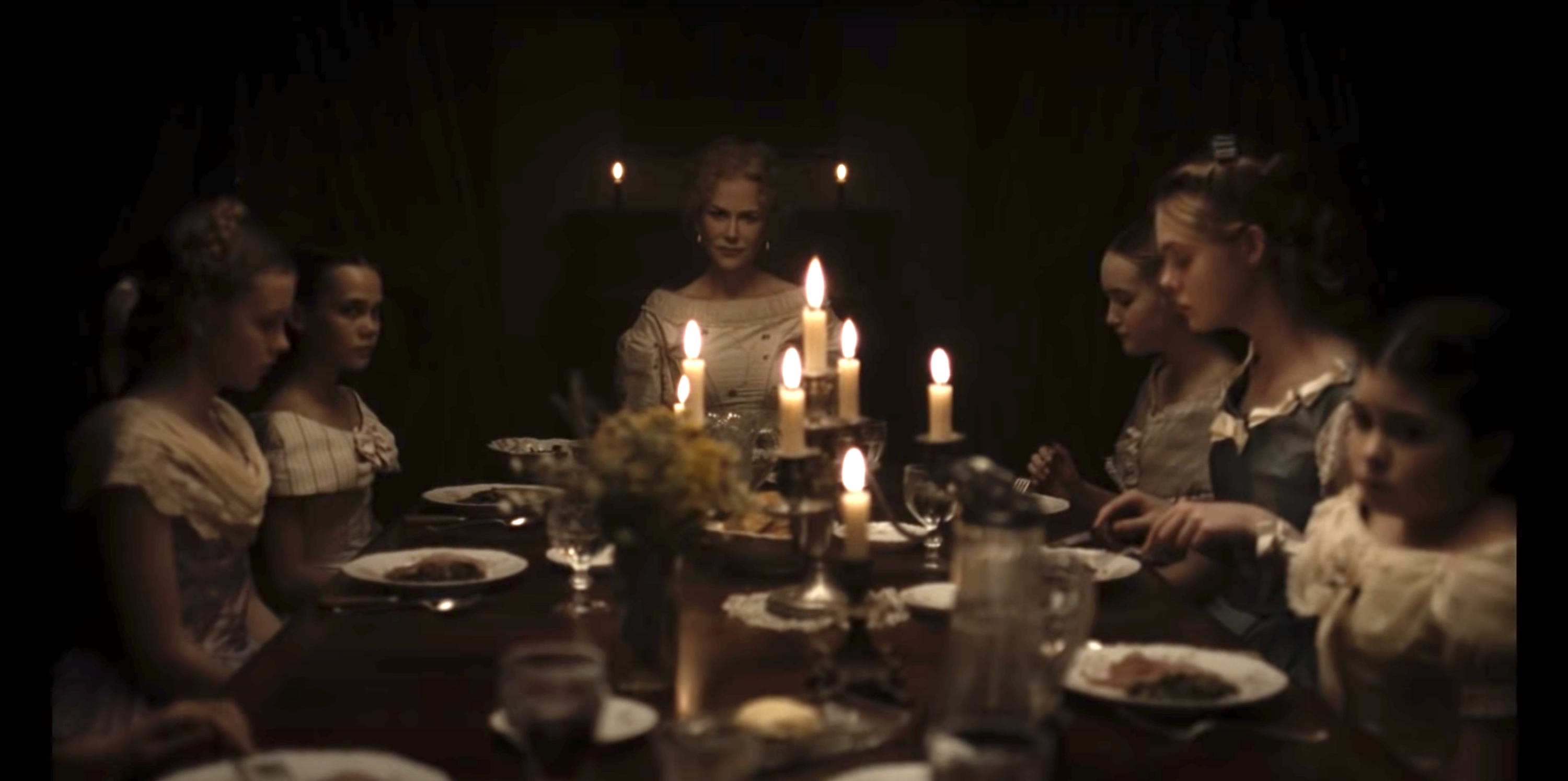 Nicole Kidman as &quot;Martha&quot; sits at the head of the table with her daughters after just poisoning a disruptive house guest in &quot;The Beguiled&quot;