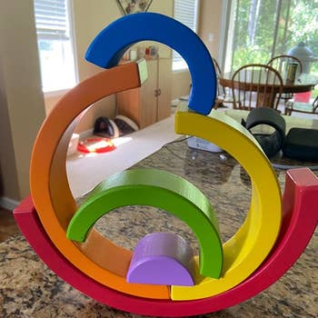 reviewer photo of stacked toy in curved shape