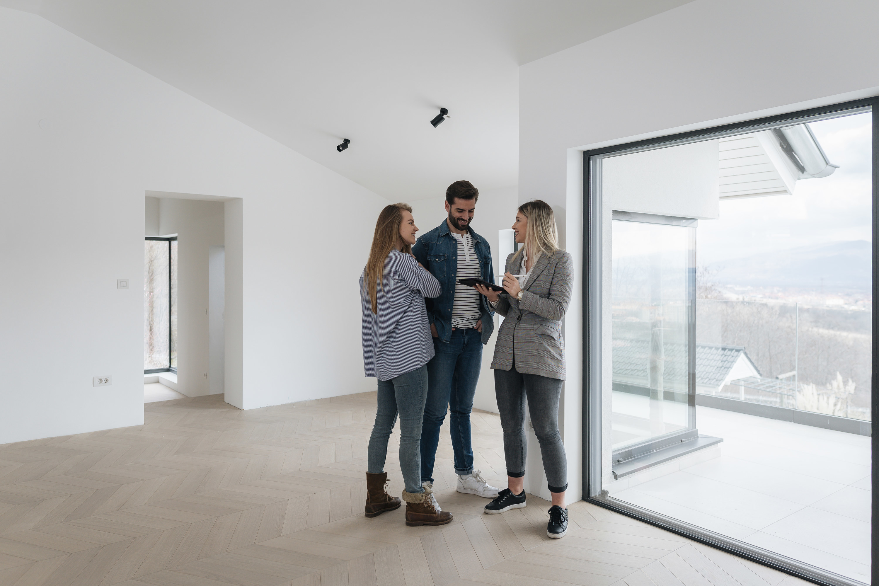 Real estate agent showing a home to prospective buyers