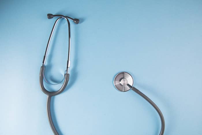 A stethoscope against a blue background