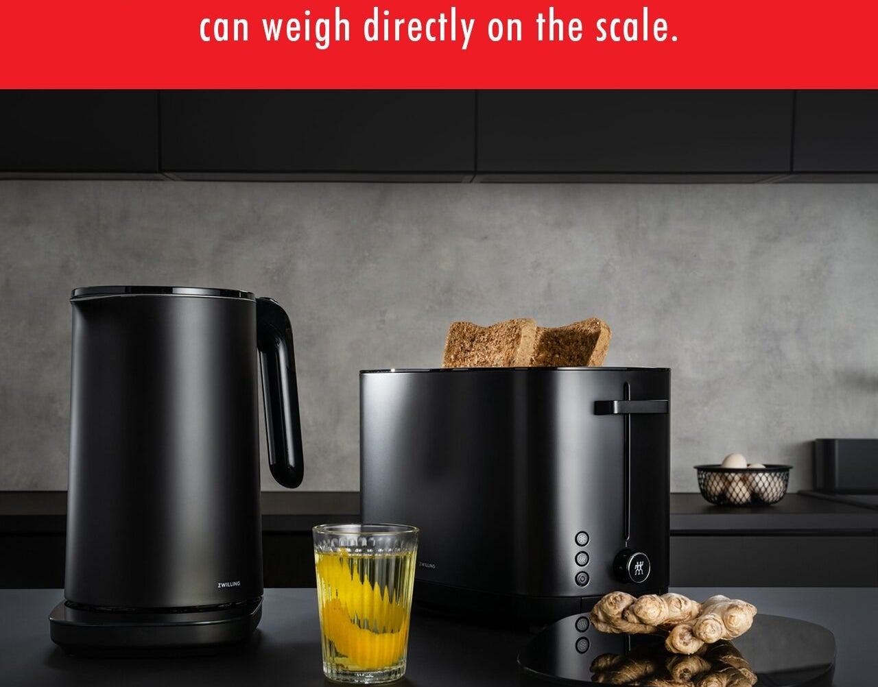 An image of a digital food scale next to other kitchen appliances