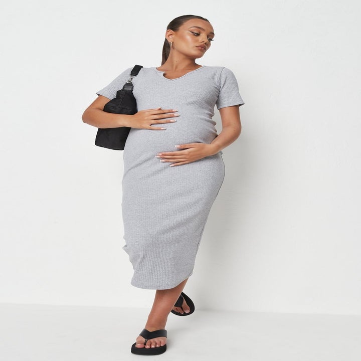 Model wearing gray midi dress