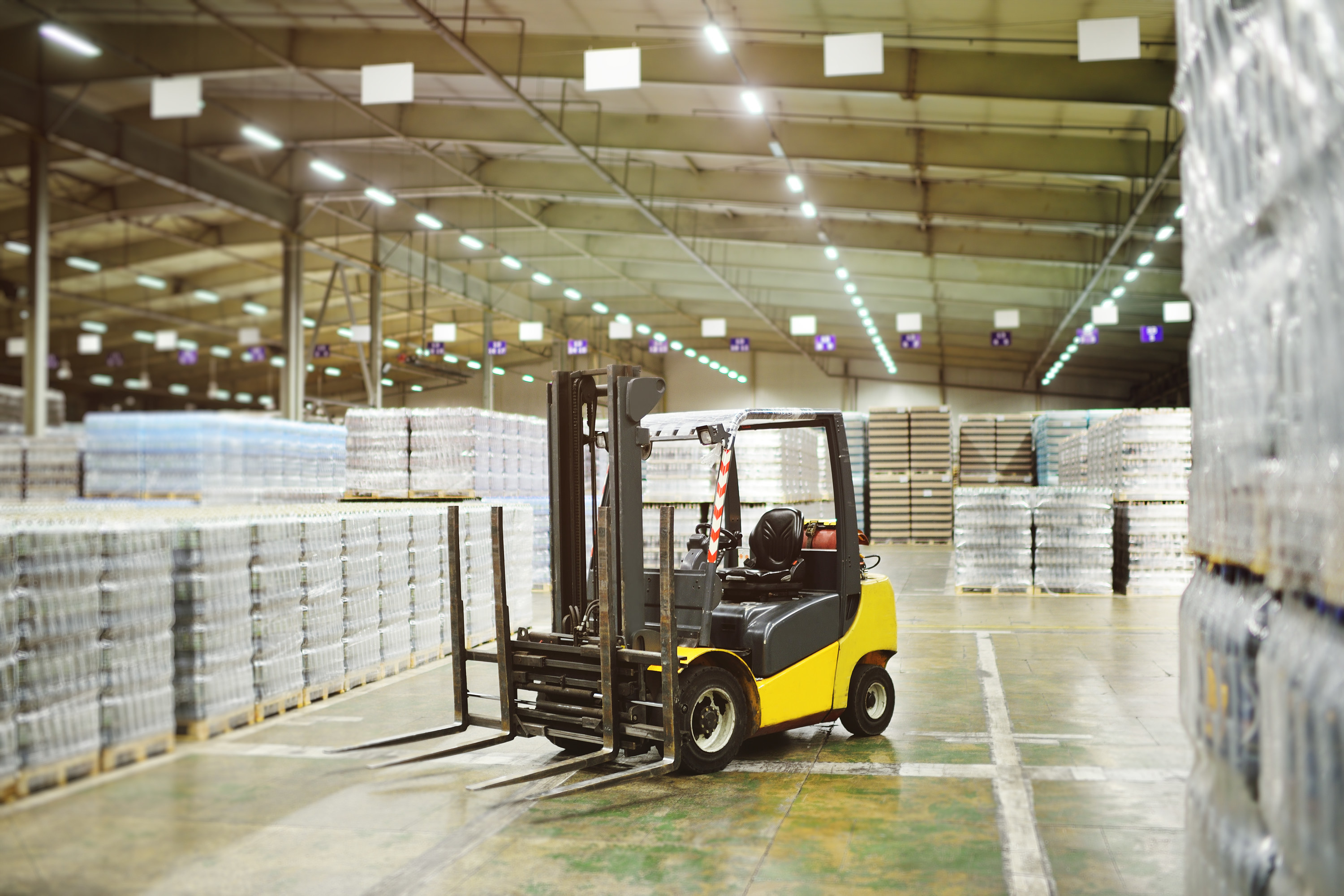 A forklift driving around a warehouse