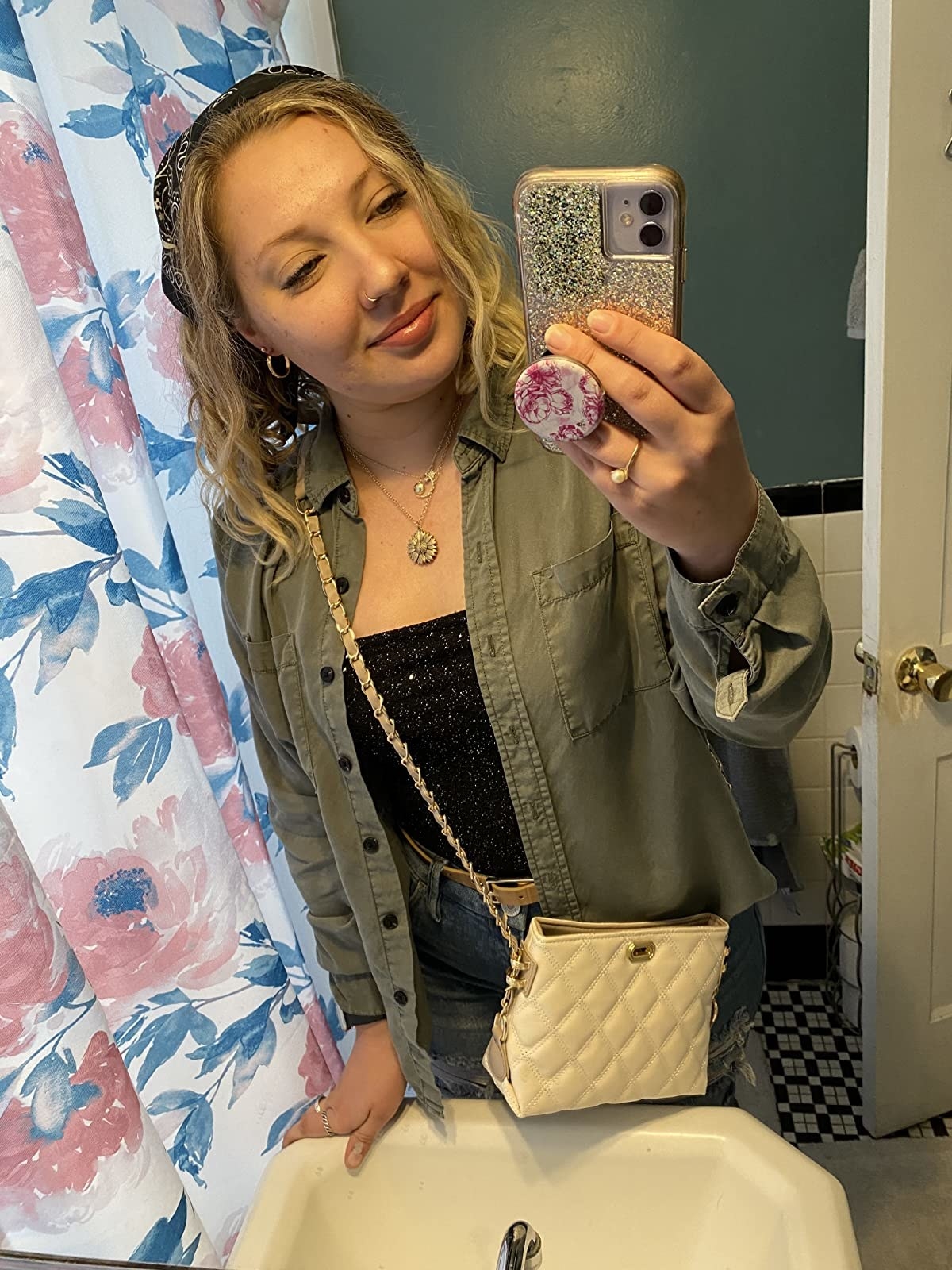 reviewer mirror selfie wearing the ivory crossbody bag