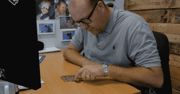 Man counting coins