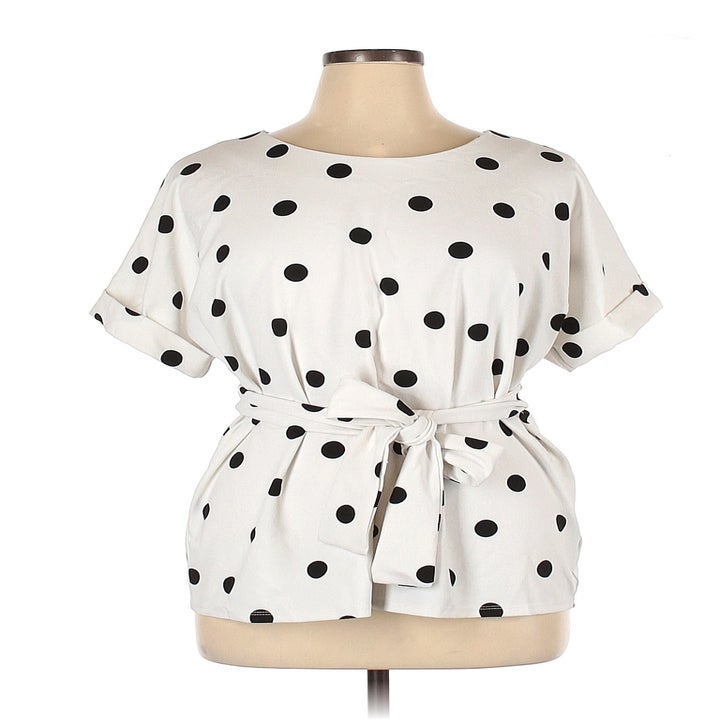 Image of white and black polka dot shirt
