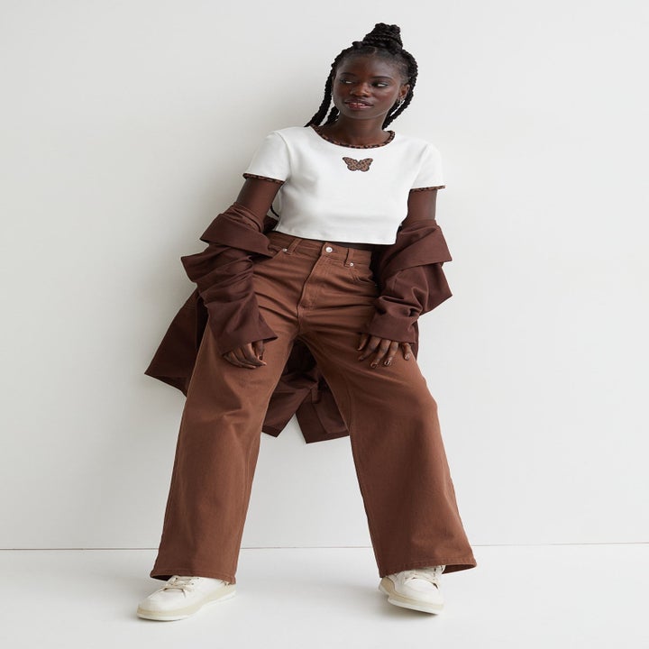 Model wearing brown pants