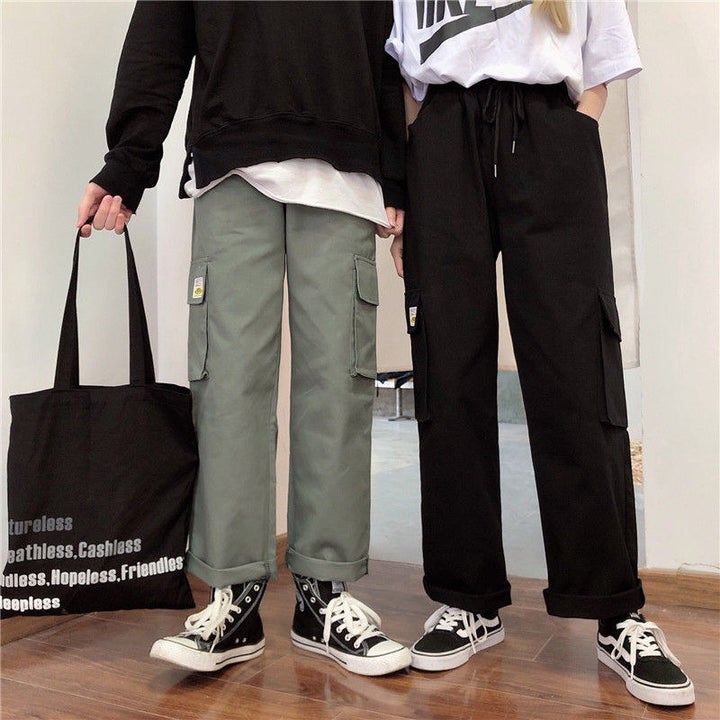 Two models wearing pants with black shoes